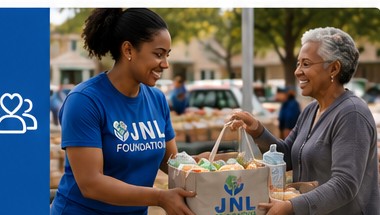 JNL Foundation volunteer delivering groceries to a community member